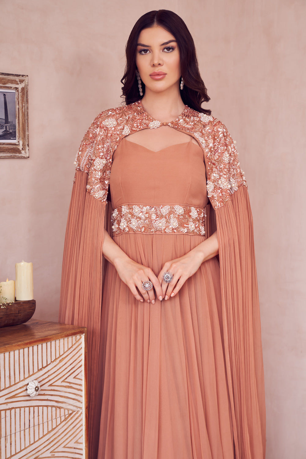 Evening Skies Rose Gold Georgette Embellished Pearl Sweetheart Gown With Cape