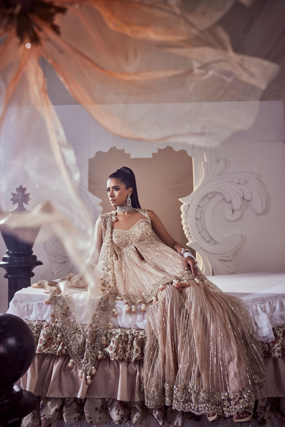 Iliana Blush Pink Hand Embellished Net Peplum Sharara Set with Deep Sweetheart Neckline