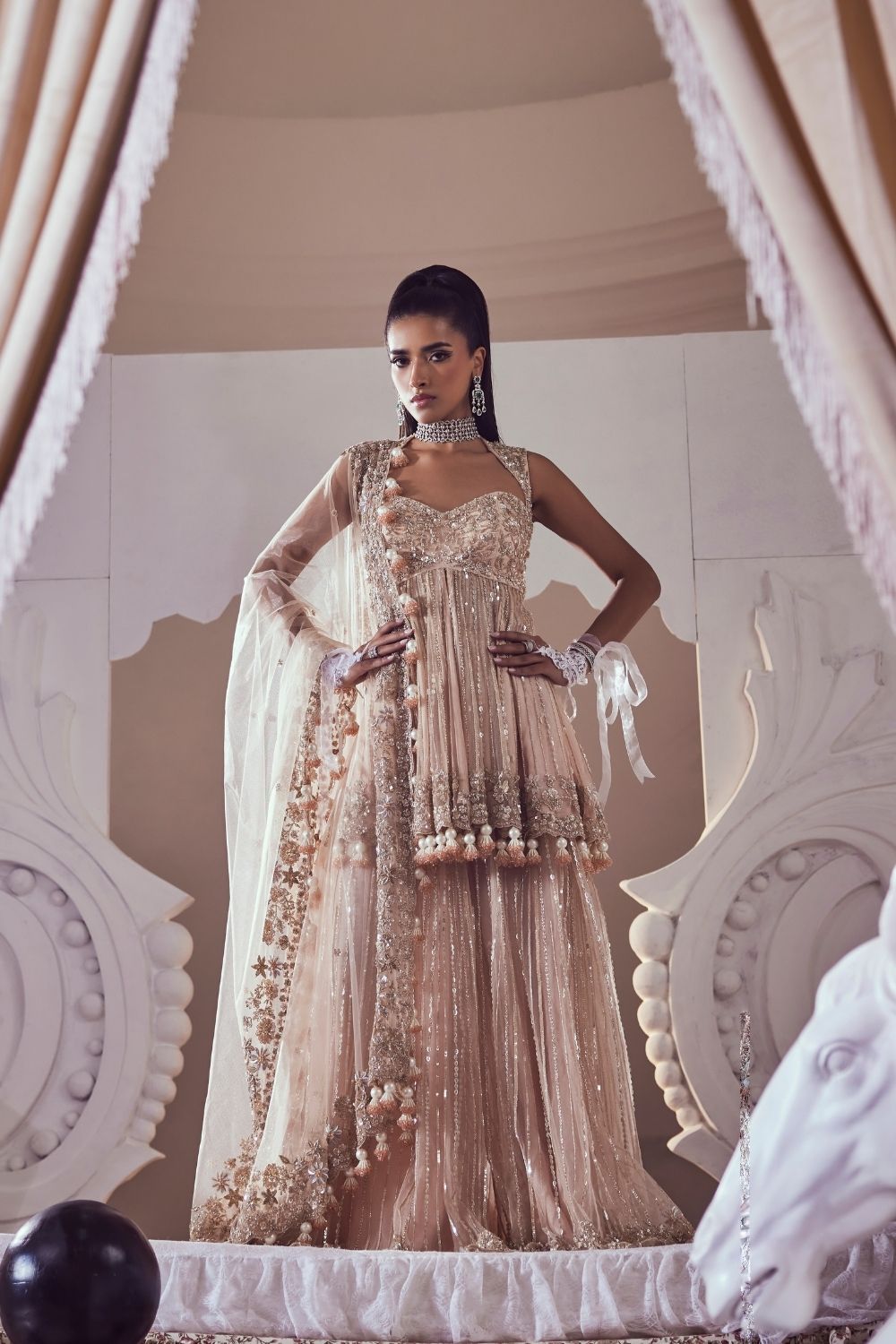 Iliana Blush Pink Hand Embellished Net Peplum Sharara Set with Deep Sweetheart Neckline