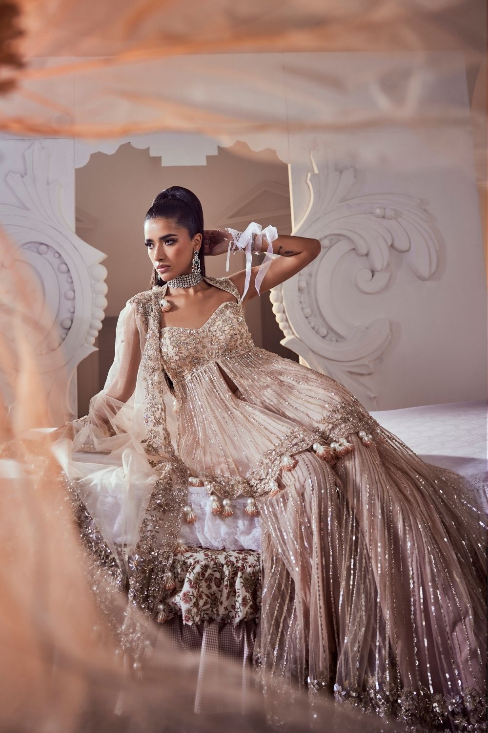 Iliana Blush Pink Hand Embellished Net Peplum Sharara Set with Deep Sweetheart Neckline