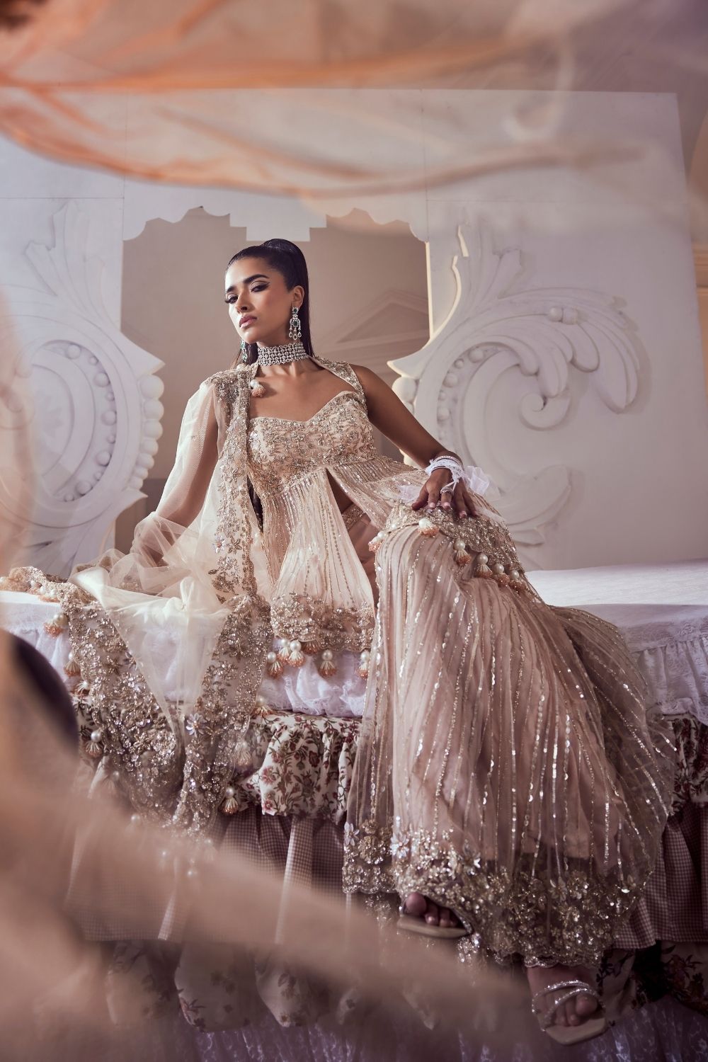 Iliana Blush Pink Hand Embellished Net Peplum Sharara Set with Deep Sweetheart Neckline