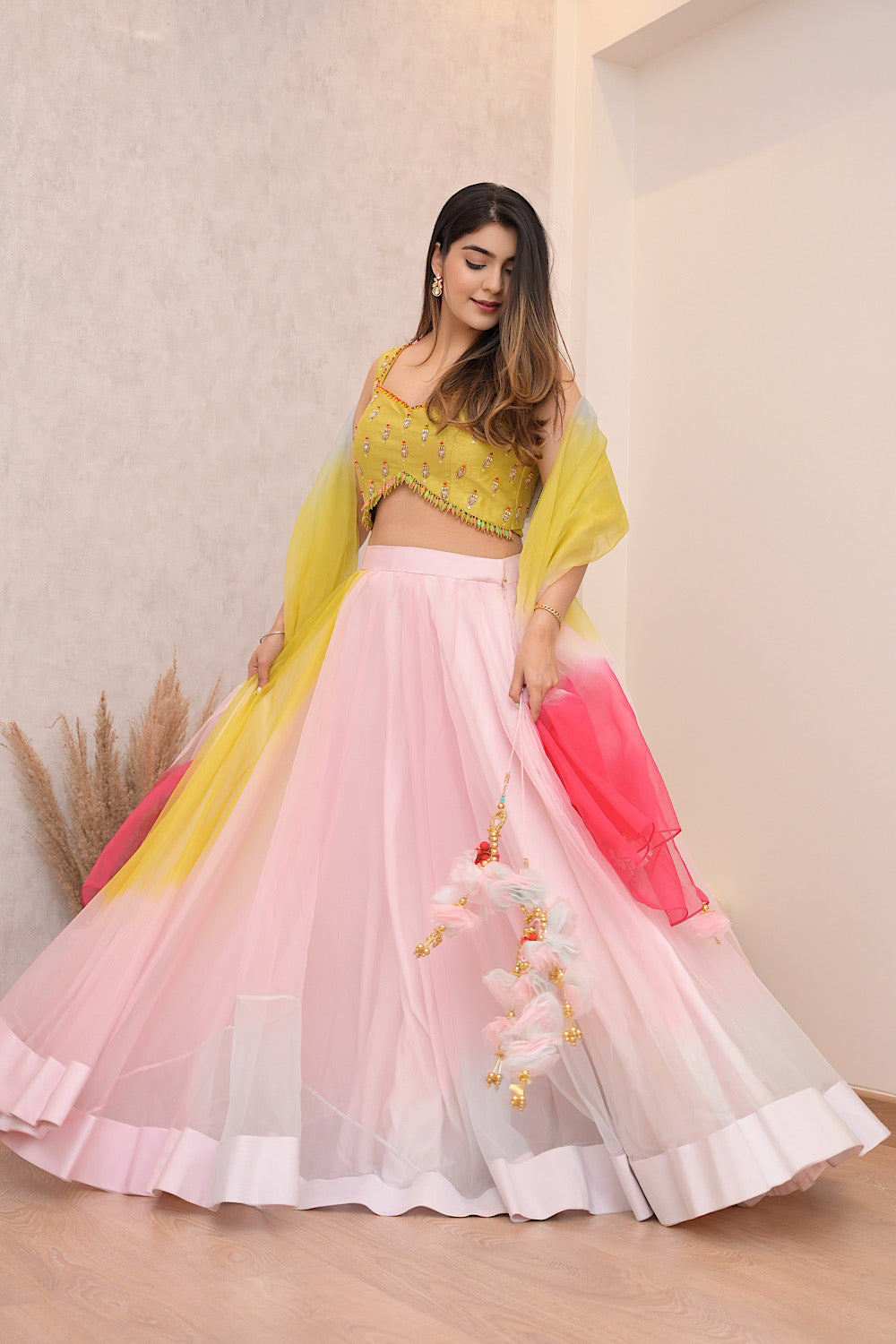 MUSTARD YELLOW EMBELLISHED BLOUSE WITH BABY PINK FLARED LEHENGA SKIRT AND OMBRE DUPATTA (7611679080694)